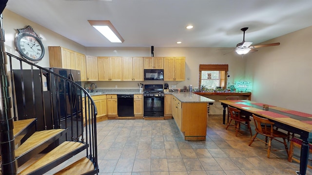 kitchen with light brown cabinets, light stone countertops, black appliances, ceiling fan, and sink