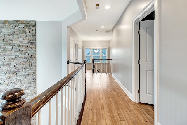 corridor featuring light hardwood / wood-style flooring