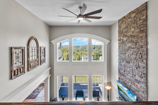 details featuring a textured ceiling and ceiling fan