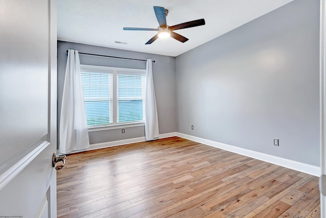 unfurnished room featuring light hardwood / wood-style floors and ceiling fan