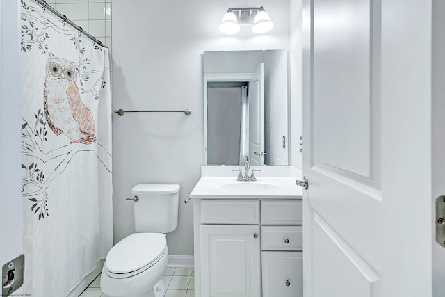 bathroom featuring tile patterned flooring, a shower with curtain, vanity, and toilet