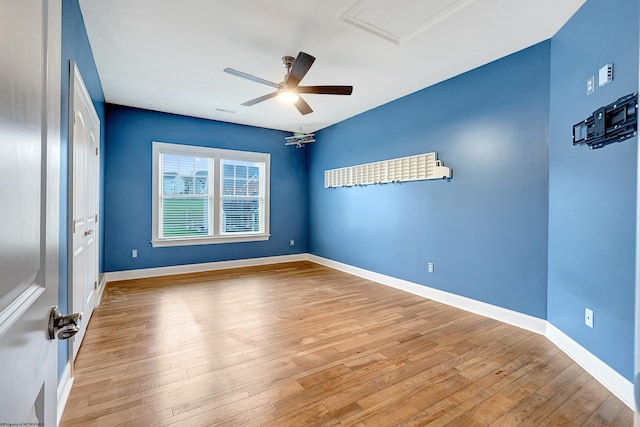 spare room with ceiling fan and light hardwood / wood-style flooring