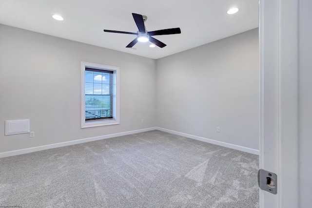 unfurnished room featuring ceiling fan and carpet flooring