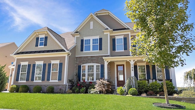 craftsman-style home featuring a front lawn