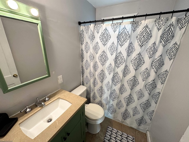 full bathroom with tile patterned floors, curtained shower, toilet, and vanity
