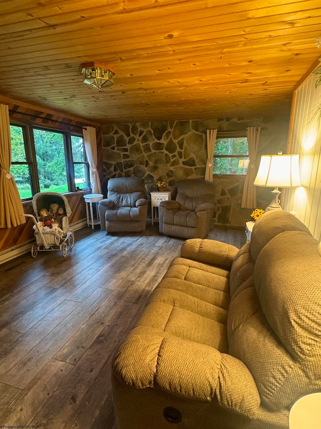 living room featuring wood-type flooring, wooden ceiling, and a healthy amount of sunlight