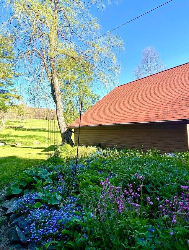 view of property exterior with a yard