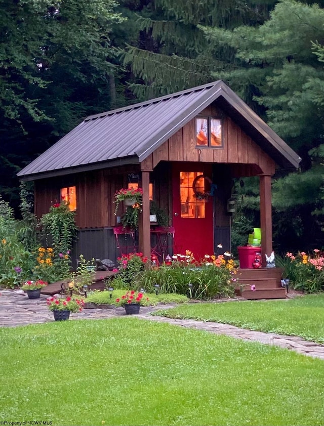 view of outdoor structure featuring a lawn