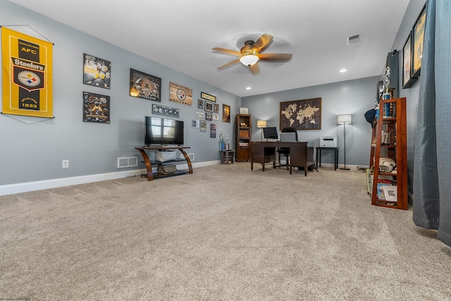 home office with ceiling fan and carpet flooring