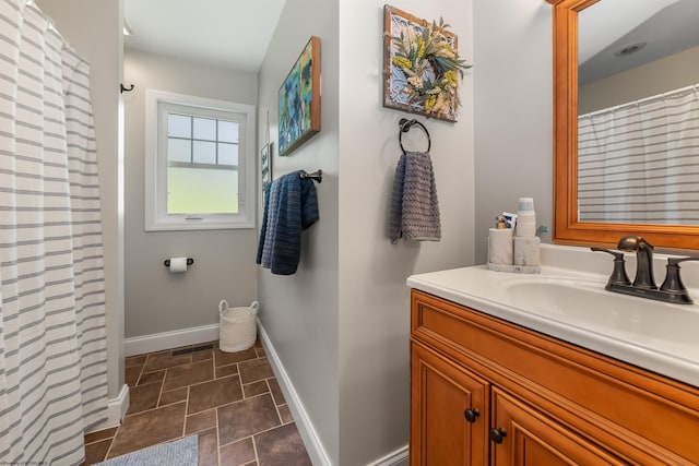 bathroom featuring vanity and tile patterned flooring