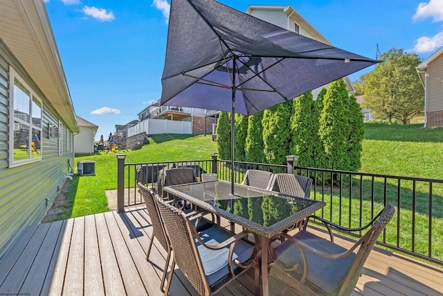 wooden deck featuring a yard and central AC unit