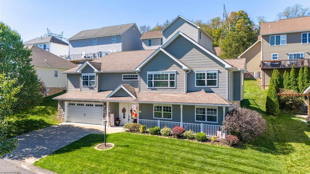 view of front of house featuring a garage and a front yard