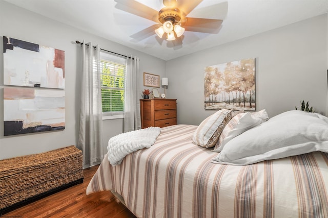 bedroom with ceiling fan and dark wood-type flooring