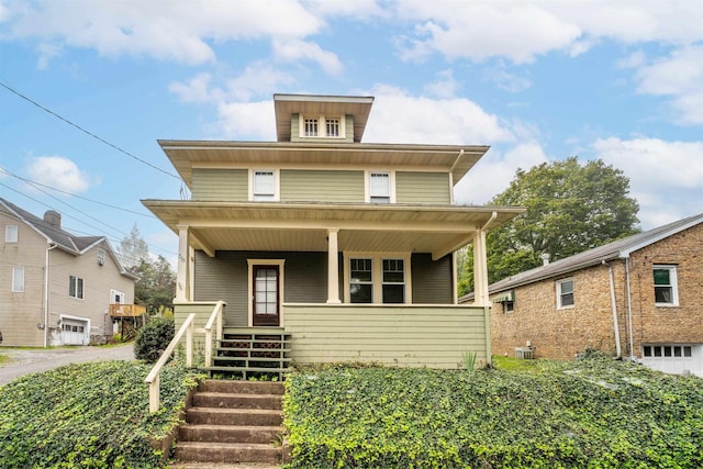 view of front of house with a porch and central AC