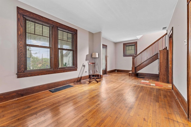 unfurnished room featuring hardwood / wood-style flooring