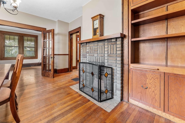 living room with light hardwood / wood-style floors and a fireplace