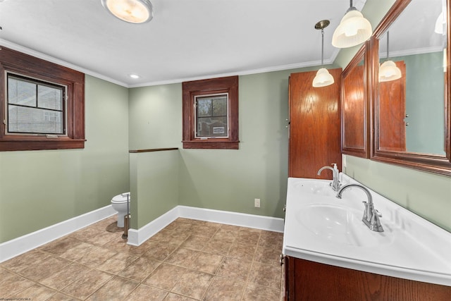 bathroom featuring tile patterned floors, crown molding, vanity, and toilet