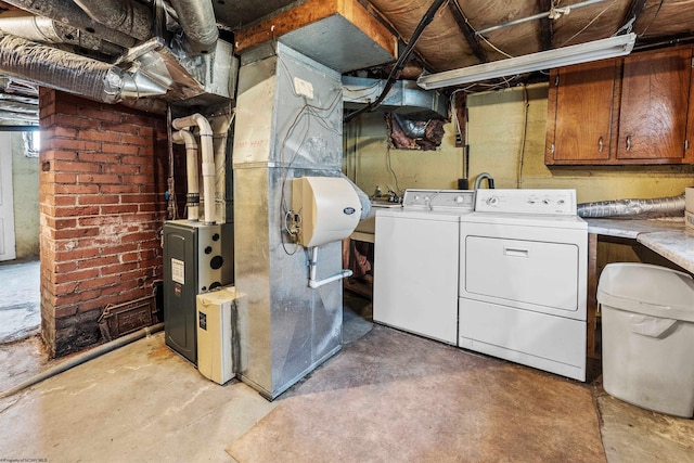 laundry area with separate washer and dryer