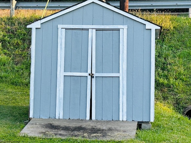 view of outdoor structure with a lawn