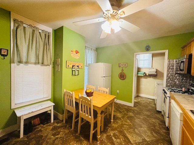 interior space featuring ceiling fan