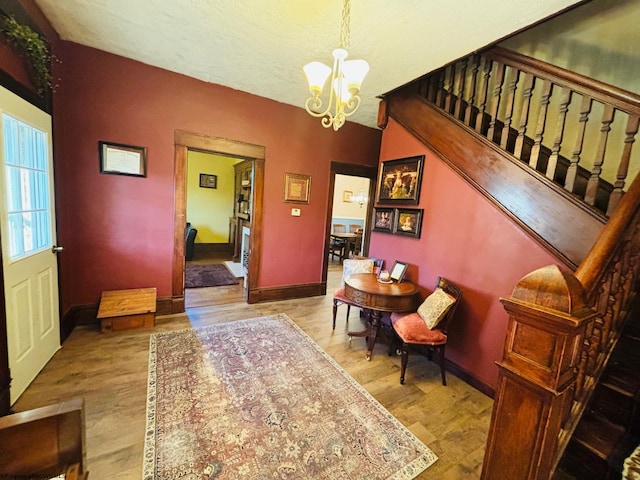 dining area featuring an inviting chandelier and light hardwood / wood-style floors