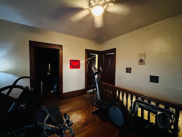 corridor with dark hardwood / wood-style flooring