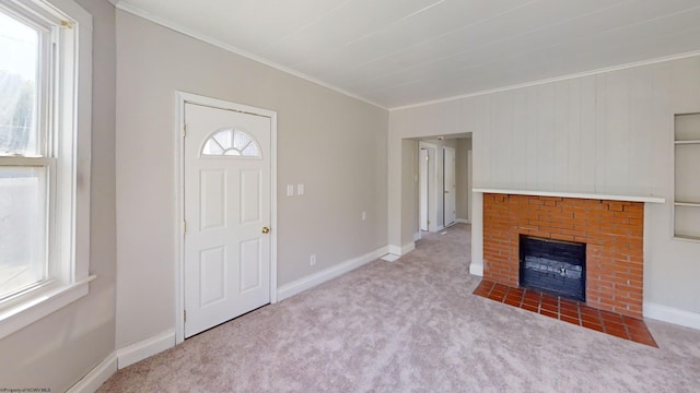 unfurnished living room with plenty of natural light, light carpet, and a fireplace