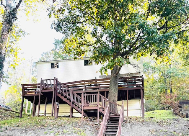 rear view of house with a wooden deck