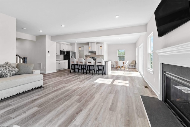 living room featuring light wood-type flooring