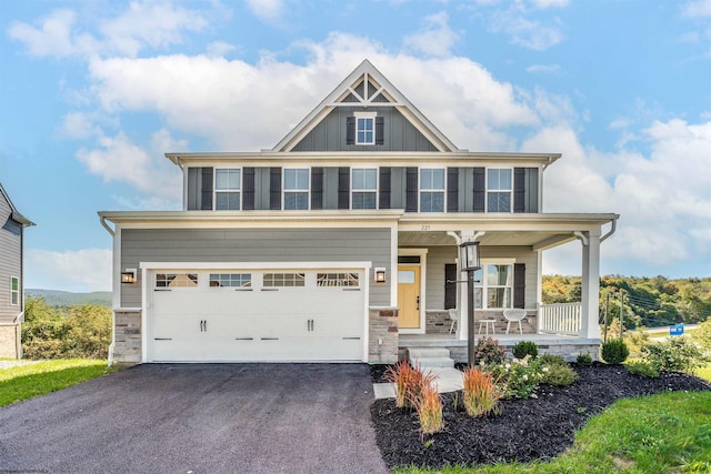 craftsman inspired home with a porch and a garage