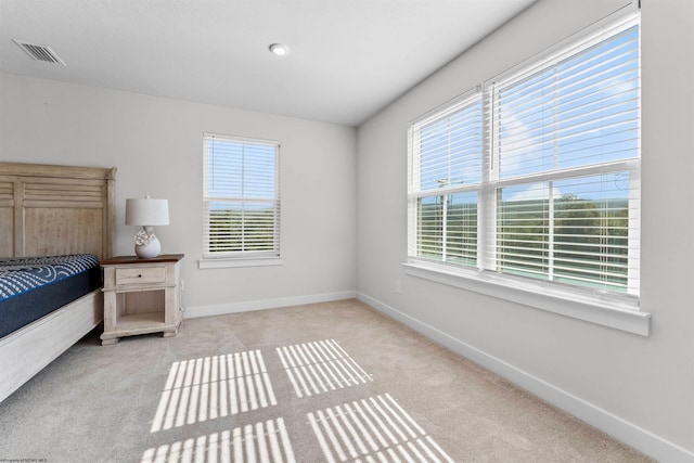 unfurnished bedroom featuring light colored carpet