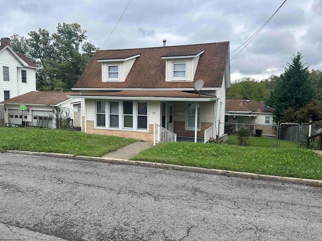 view of front of property with a front yard and a porch