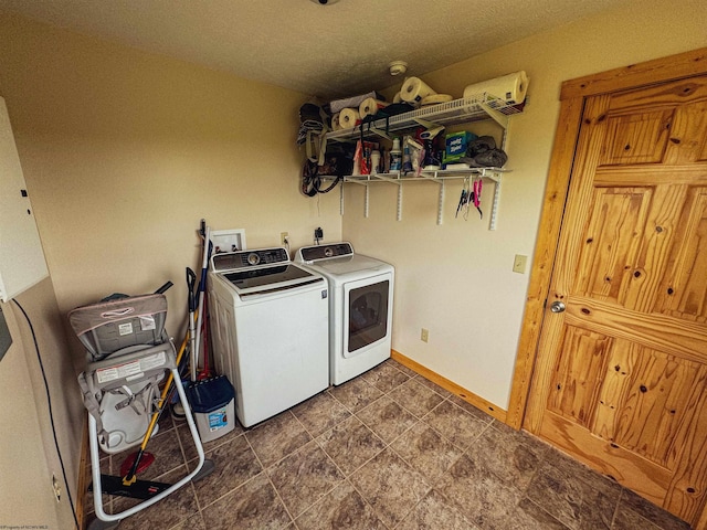 clothes washing area with washing machine and clothes dryer