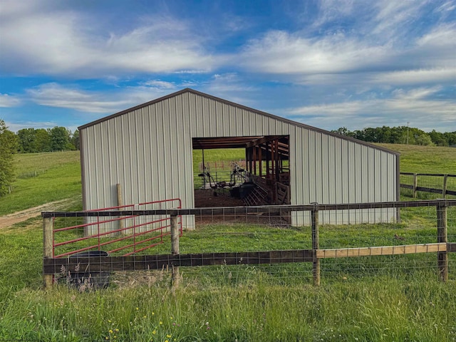 view of outbuilding featuring a rural view