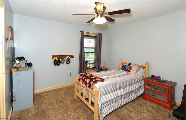 bedroom featuring a textured ceiling, carpet, and ceiling fan