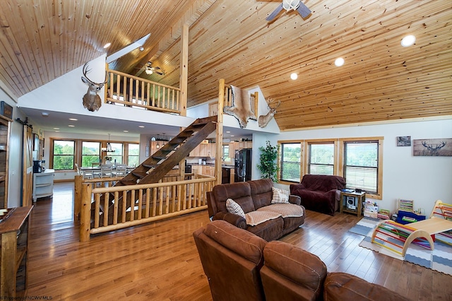 living room with ceiling fan, hardwood / wood-style flooring, wood ceiling, and high vaulted ceiling