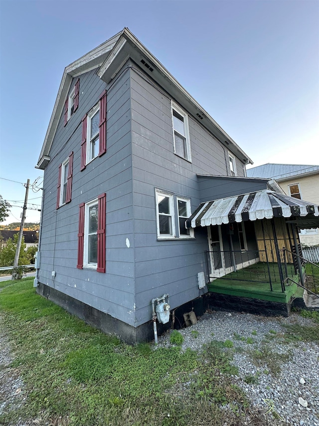 view of home's exterior featuring a yard