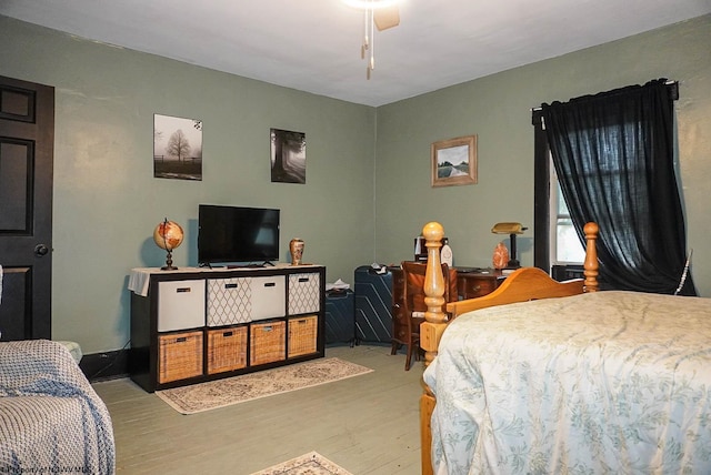 bedroom with ceiling fan and light hardwood / wood-style floors