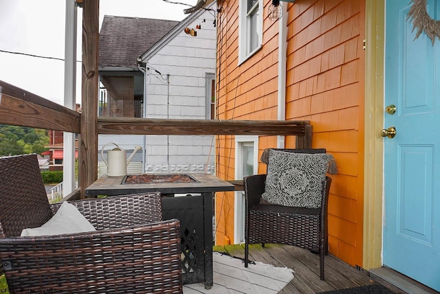 deck featuring an outdoor fire pit