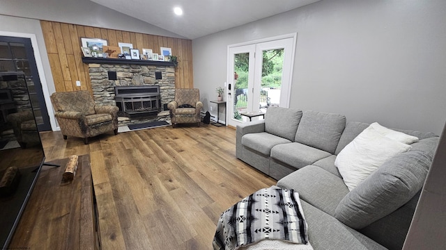 living room with hardwood / wood-style floors and vaulted ceiling