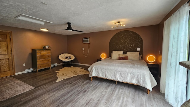 bedroom featuring ceiling fan, a wall mounted air conditioner, wood-type flooring, and a textured ceiling