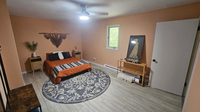 bedroom featuring ceiling fan and hardwood / wood-style floors