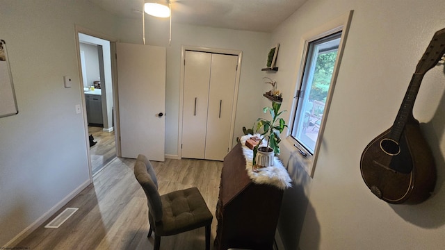 dining space with ceiling fan and light hardwood / wood-style floors