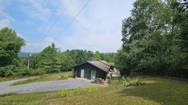 view of side of home featuring a yard