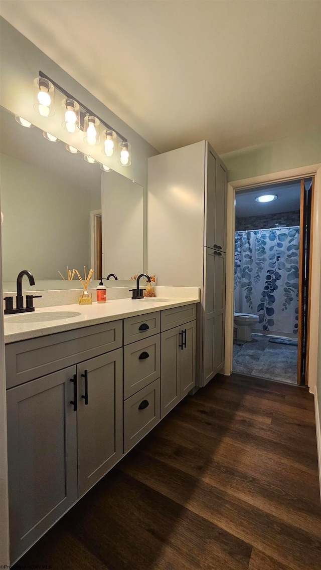 bathroom featuring vanity and hardwood / wood-style flooring