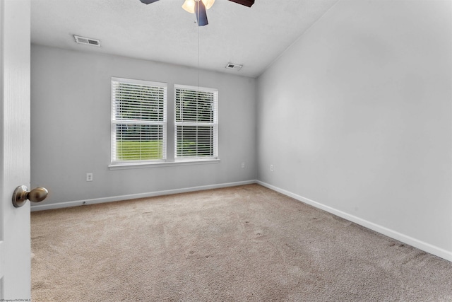 carpeted empty room with ceiling fan