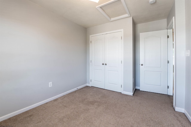 unfurnished bedroom with carpet floors and a closet