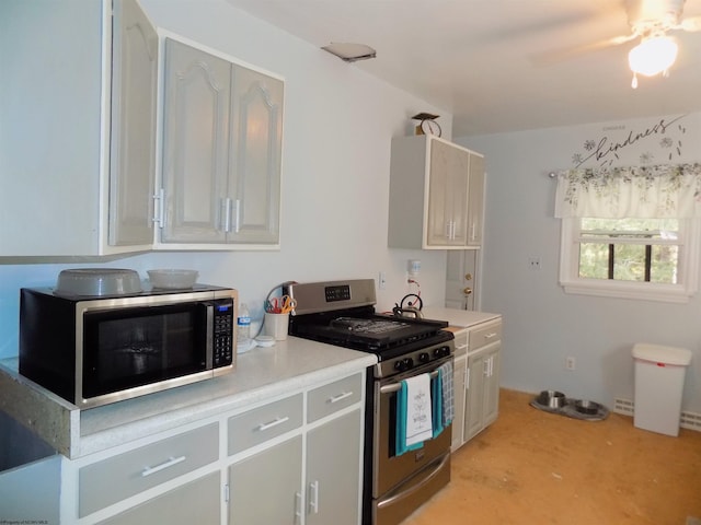 kitchen with ceiling fan and stainless steel appliances