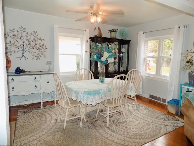 dining space featuring ceiling fan and hardwood / wood-style flooring