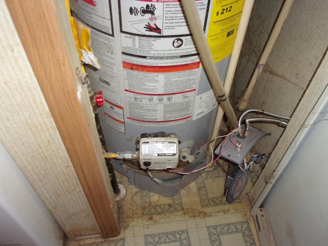 utility room featuring gas water heater